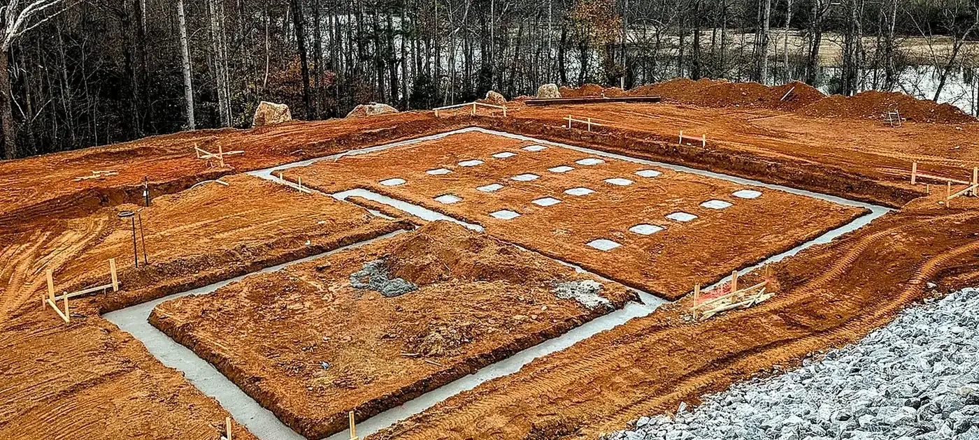 Prepared building pad and foundation footprint on red clay services by 3 George's Grading