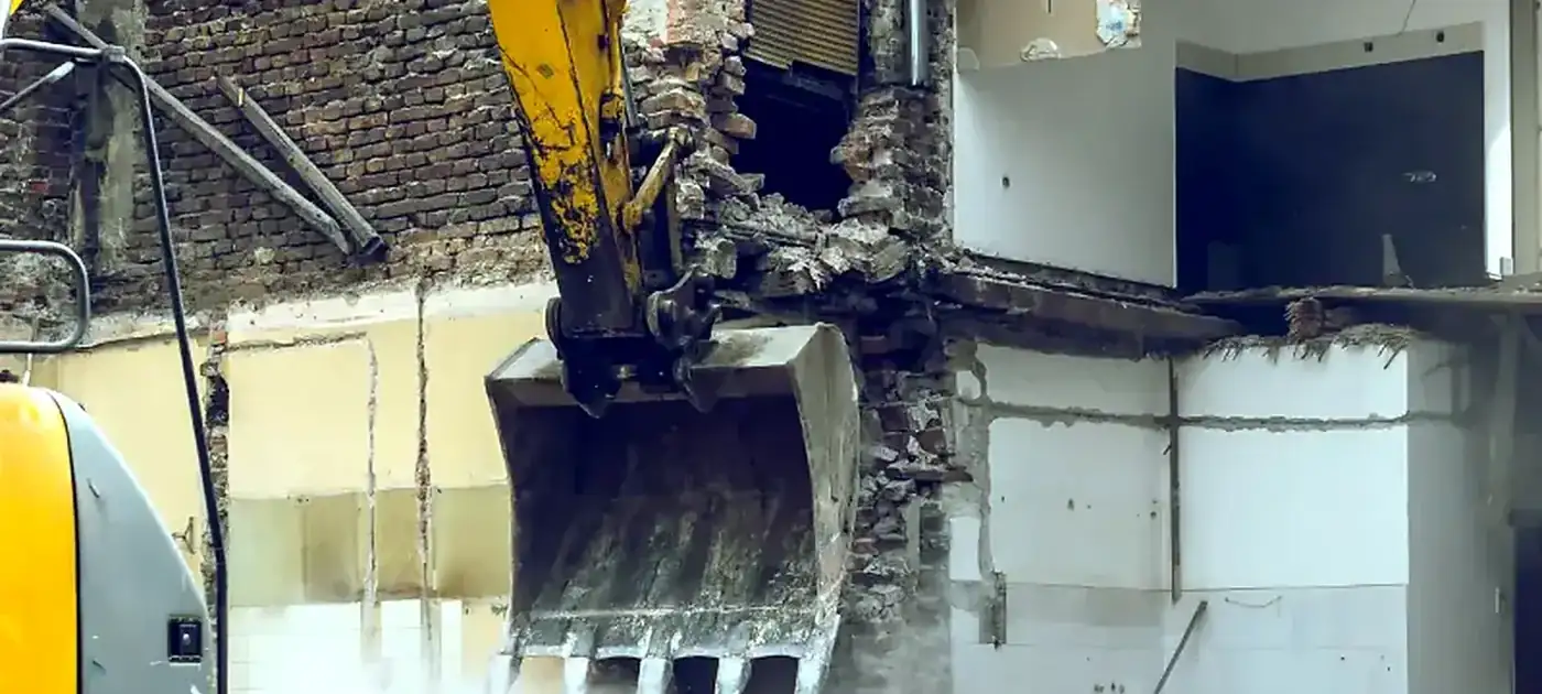 Heavy equipment performing controlled demolition services by 3 George's Grading