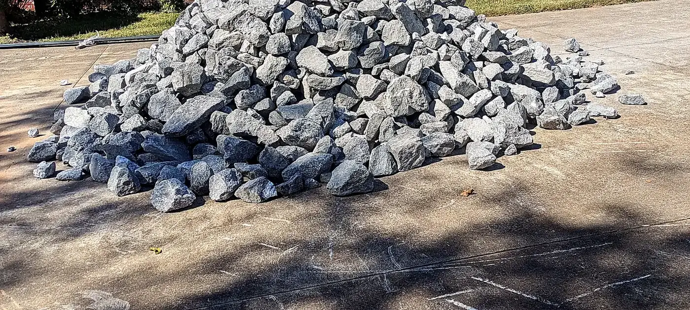 Delivered stone ready for placement at a residential project services by 3 George's Grading